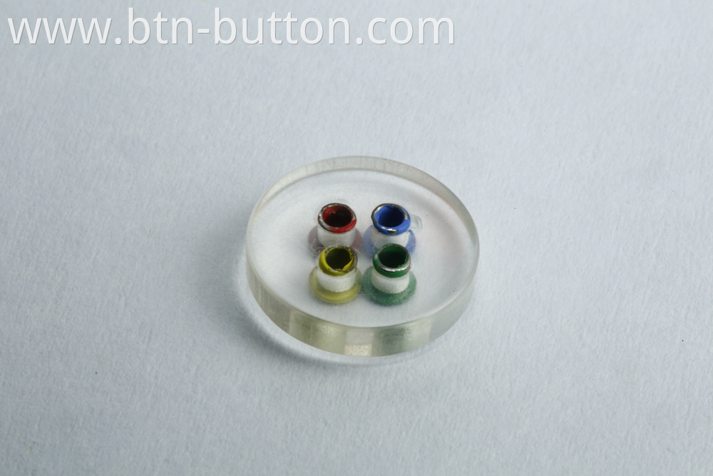 Four-hole color transparent button